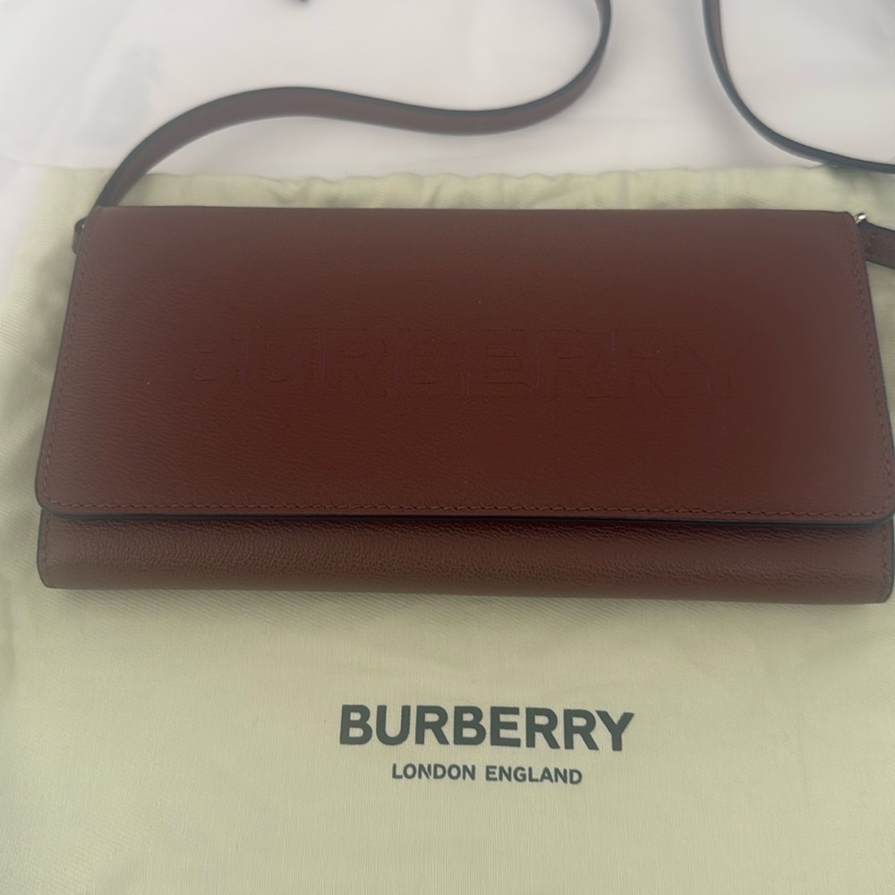 Brand new original crossbody wallet .12 centimeters high; 21 centimeters width